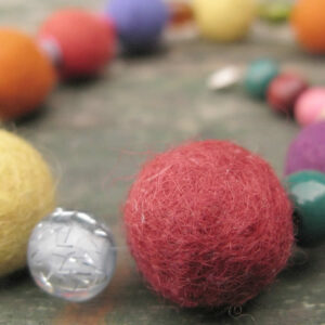 Handmade felt bracelets and necklace with woolen and wooden beads in fun colours