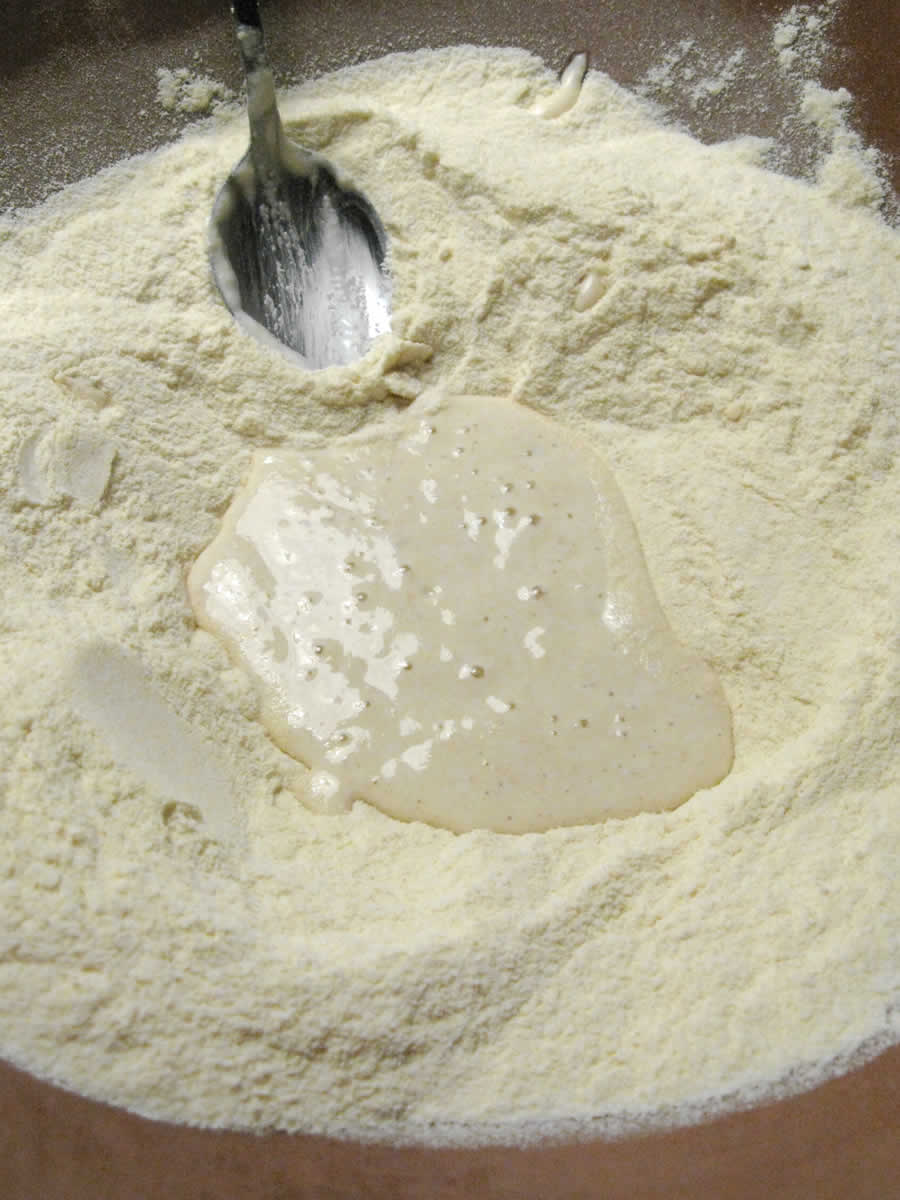 mixing sourdough and flour