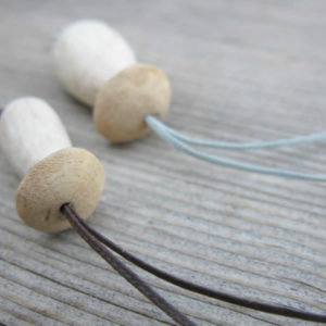 Handmade porcini necklaces made from oak wood and waxed thread